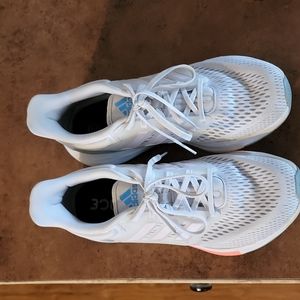 Women Addias Size 8  Grey with pink on bottom and blue around the heel worn once